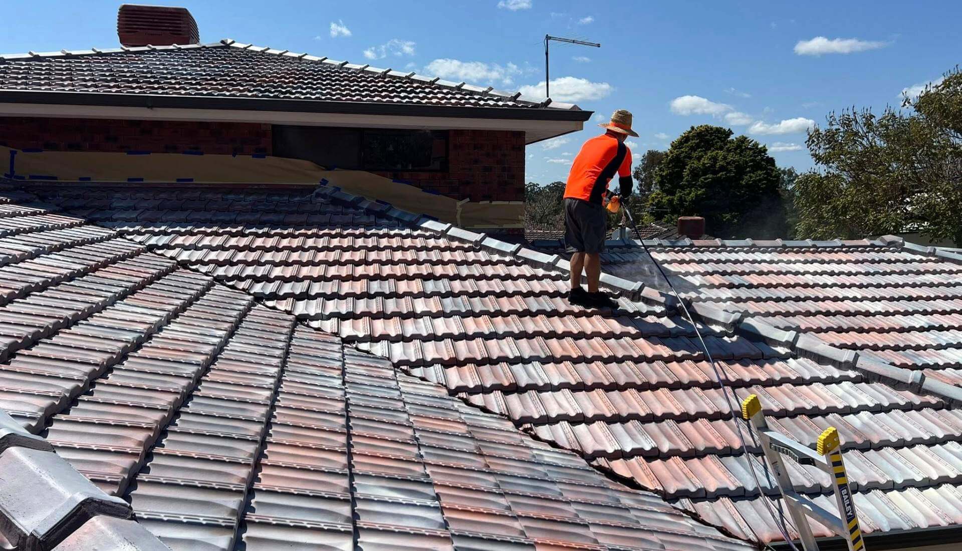 Roof repairs Gilberton SA 5081 - terracotta villa roof and adjoining terrace rooflines on a Gilberton street, Adelaide, Australia